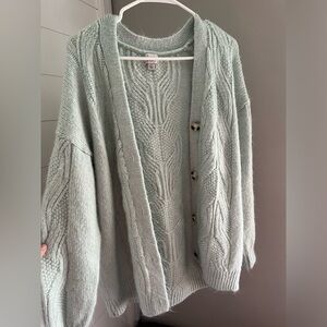 Mint green sweater with stitch detail